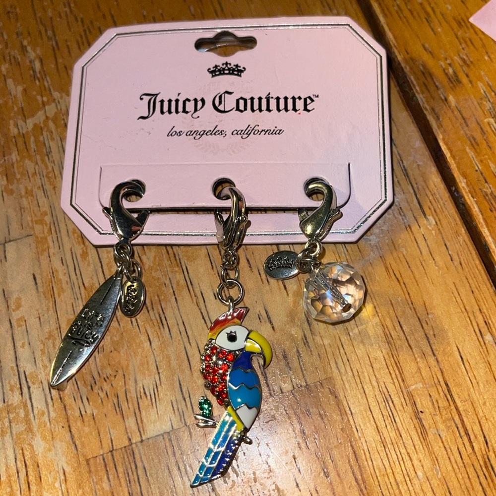 Juicy Couture surfboard, parrot, crystal gemstone